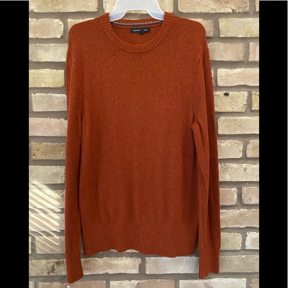Burnt orange sweater.